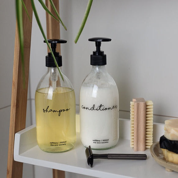 Clear Glass Bottle with Black printed text Shampoo  & Conditioner 500ml Refillery Bottle in a Bathroom setting