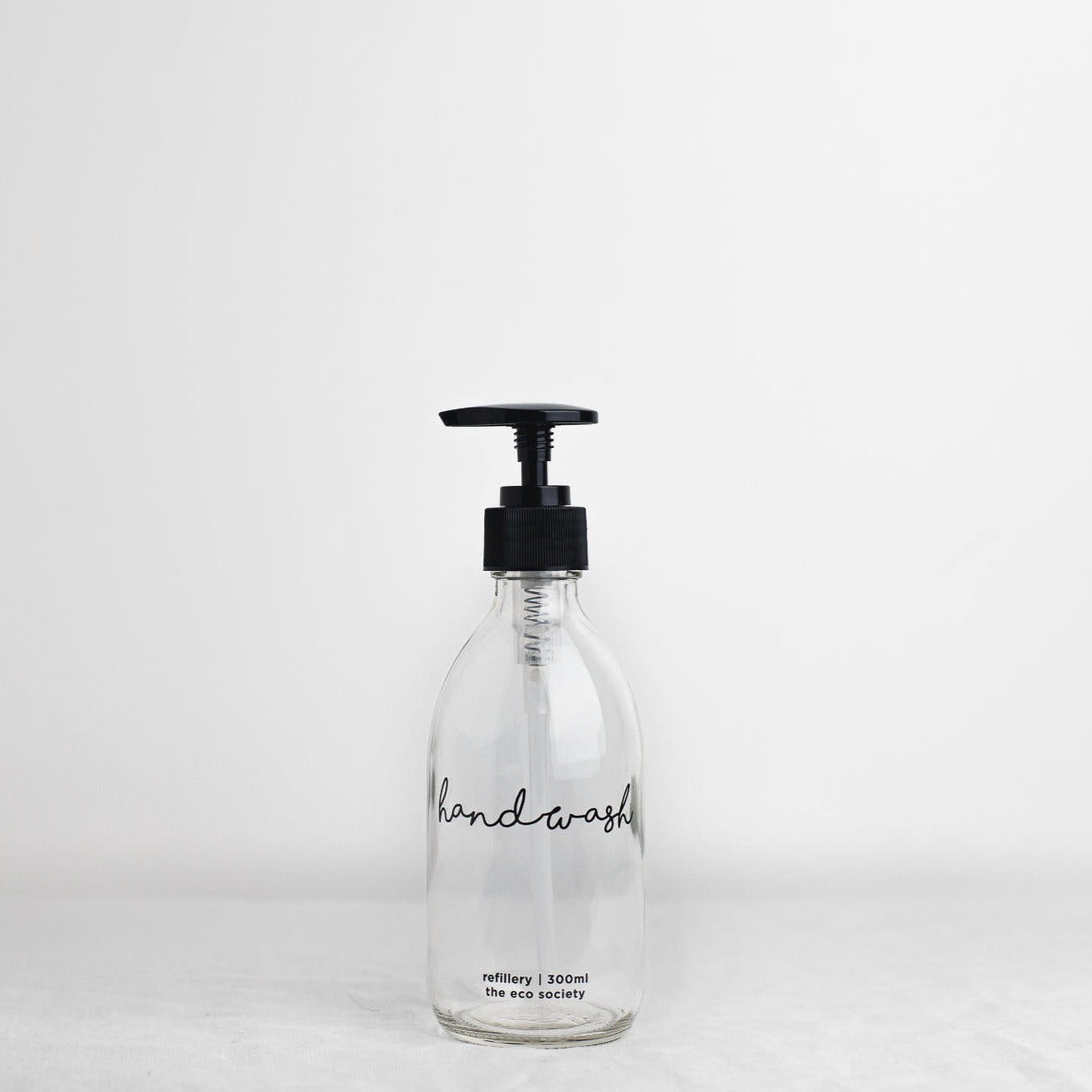 Clear Glass Bottle with Black printed text "Handwash" 300ml Refillery Bottle 